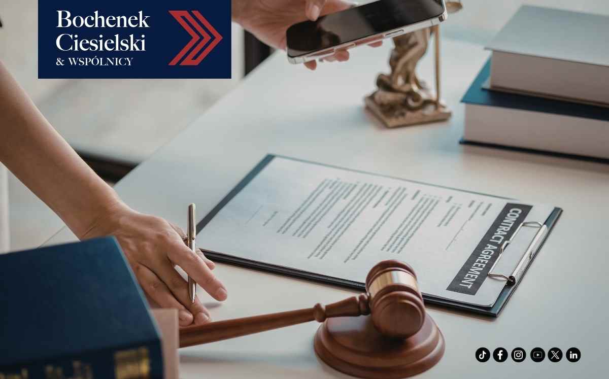 Legal contract on a clipboard with a gavel nearby as a hand signs with a pen; Bochenek Ciesielski & Wspólnicy logo in the top-left corner.
