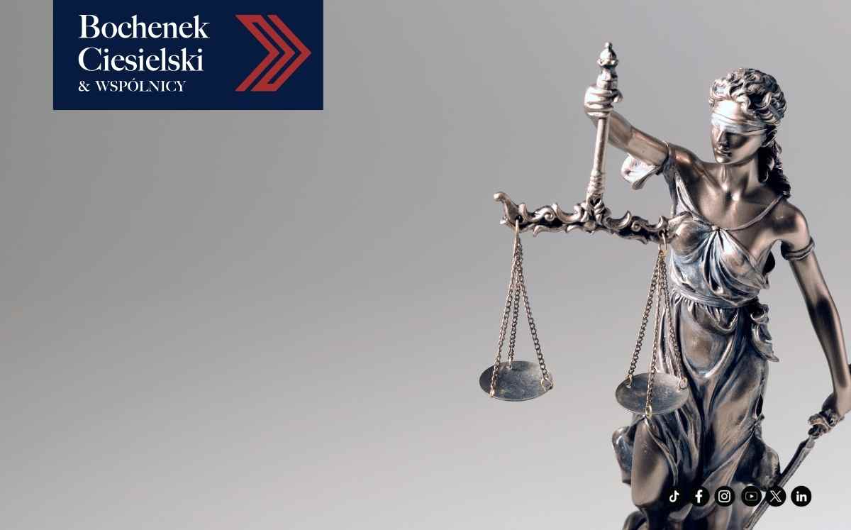Statue of Lady Justice holding scales and a sword, with a law firm logo in the top-left against a gray gradient background.